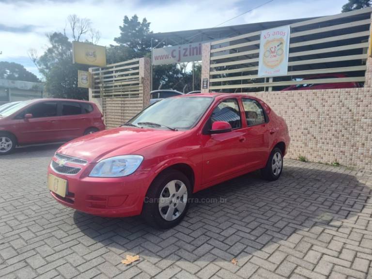 CHEVROLET - PRISMA - 2011/2012 - Vermelha - R$ 29.900,00