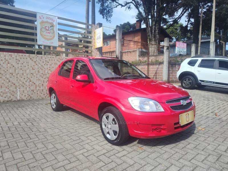 CHEVROLET - PRISMA - 2011/2012 - Vermelha - R$ 29.900,00